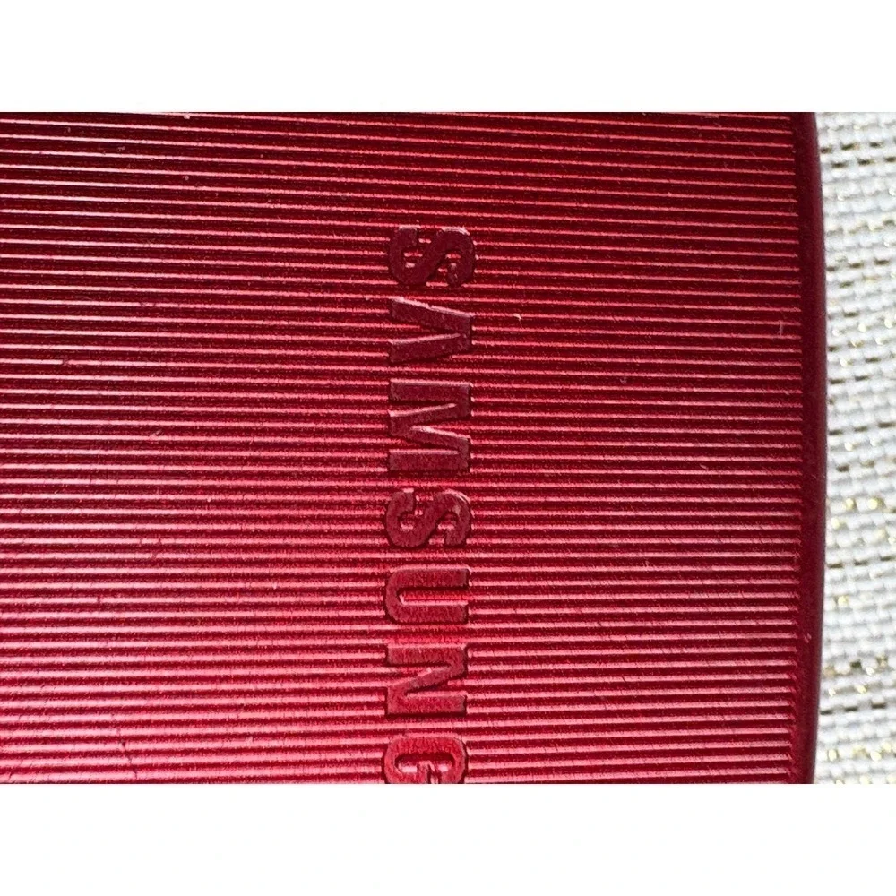 red Samsung SGH-A777, a 3G slider phone